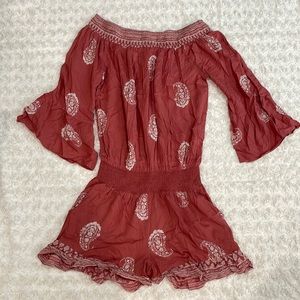 Size S Romper. Pink and white. Never worn.